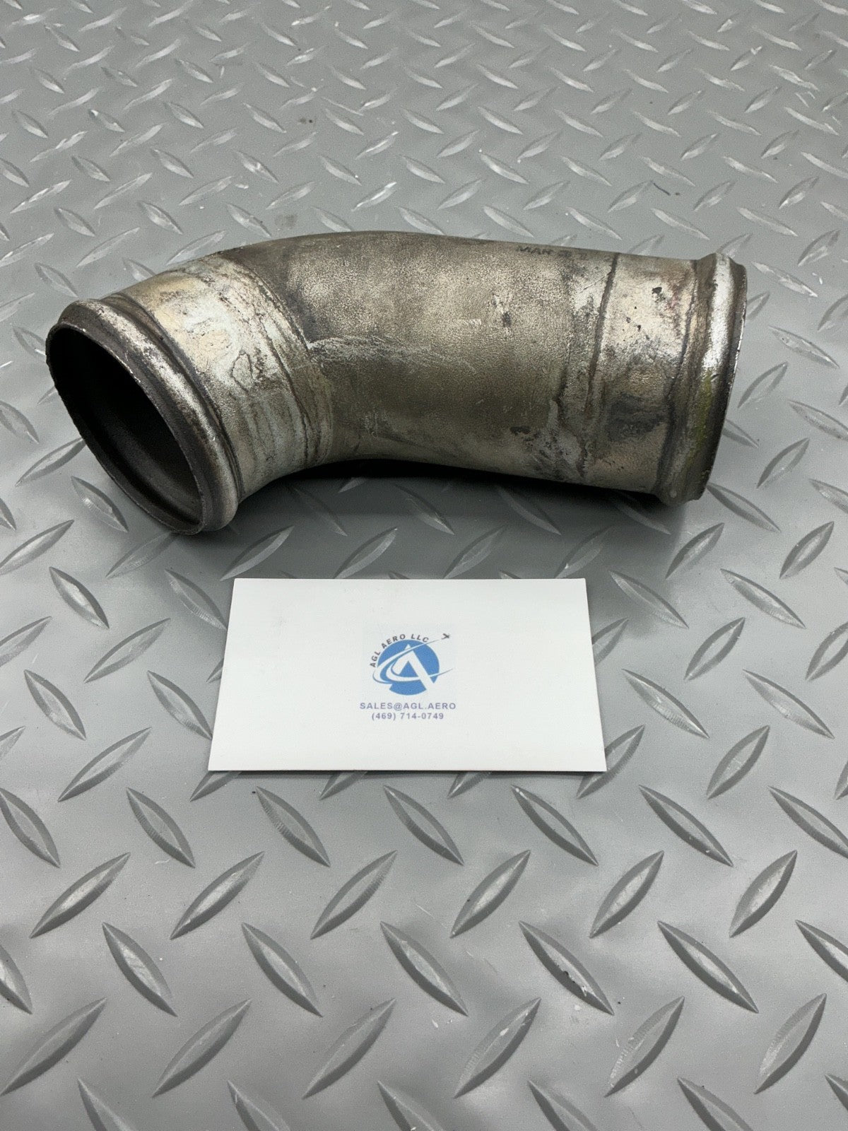 P/N: 646676 TCM Intake Tube Elbow Cylinders 1-3-5 (AR) - for one